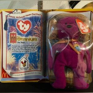 Retired TY Beanie Baby: Millennium The Bear in sealed package.